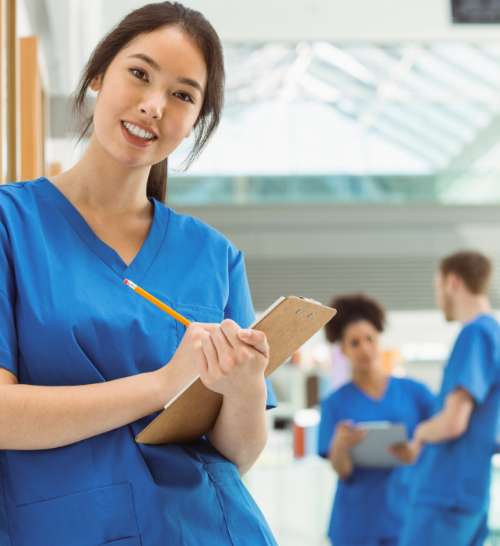 Nurse completing patient forms